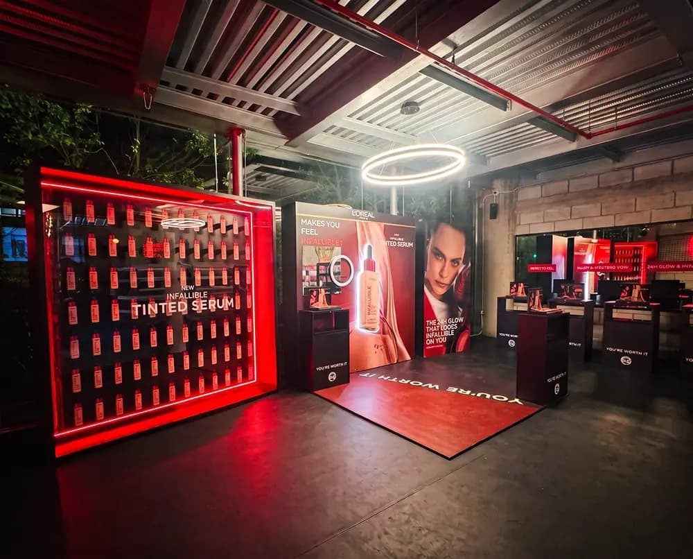 L'Oréal Infallible Tinted Serum launch activation with an illuminated product wall built by Proink