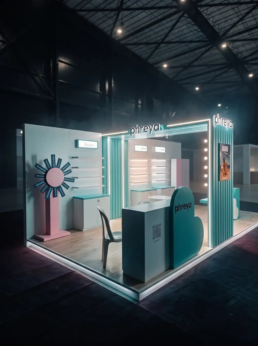 Phreya exhibition stand with an illuminated entrance portal and backlit shelving built by Proink