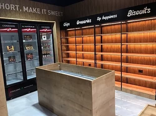 Timber counter and integrated coolers within the confectionery store fit-out