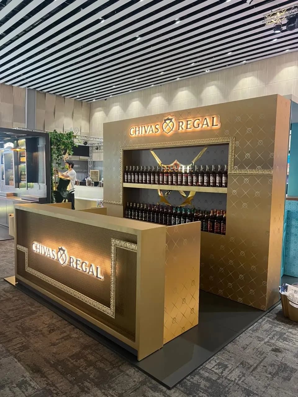 Chivas Regal backlit bottle display recess with the brand emblem in gold