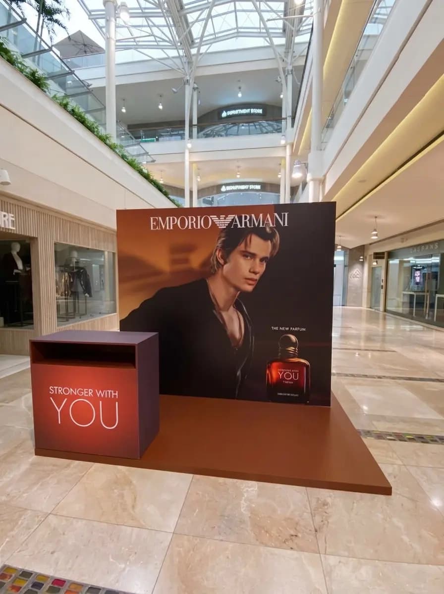 Emporio Armani campaign display unit installed in a shopping mall corridor