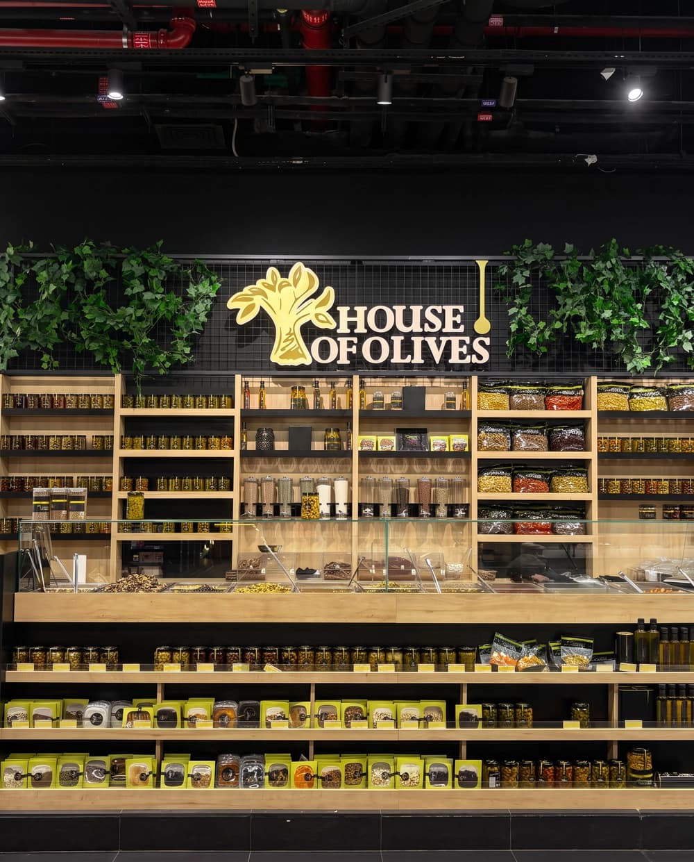 Branded House of Olives concession installed inside a supermarket
