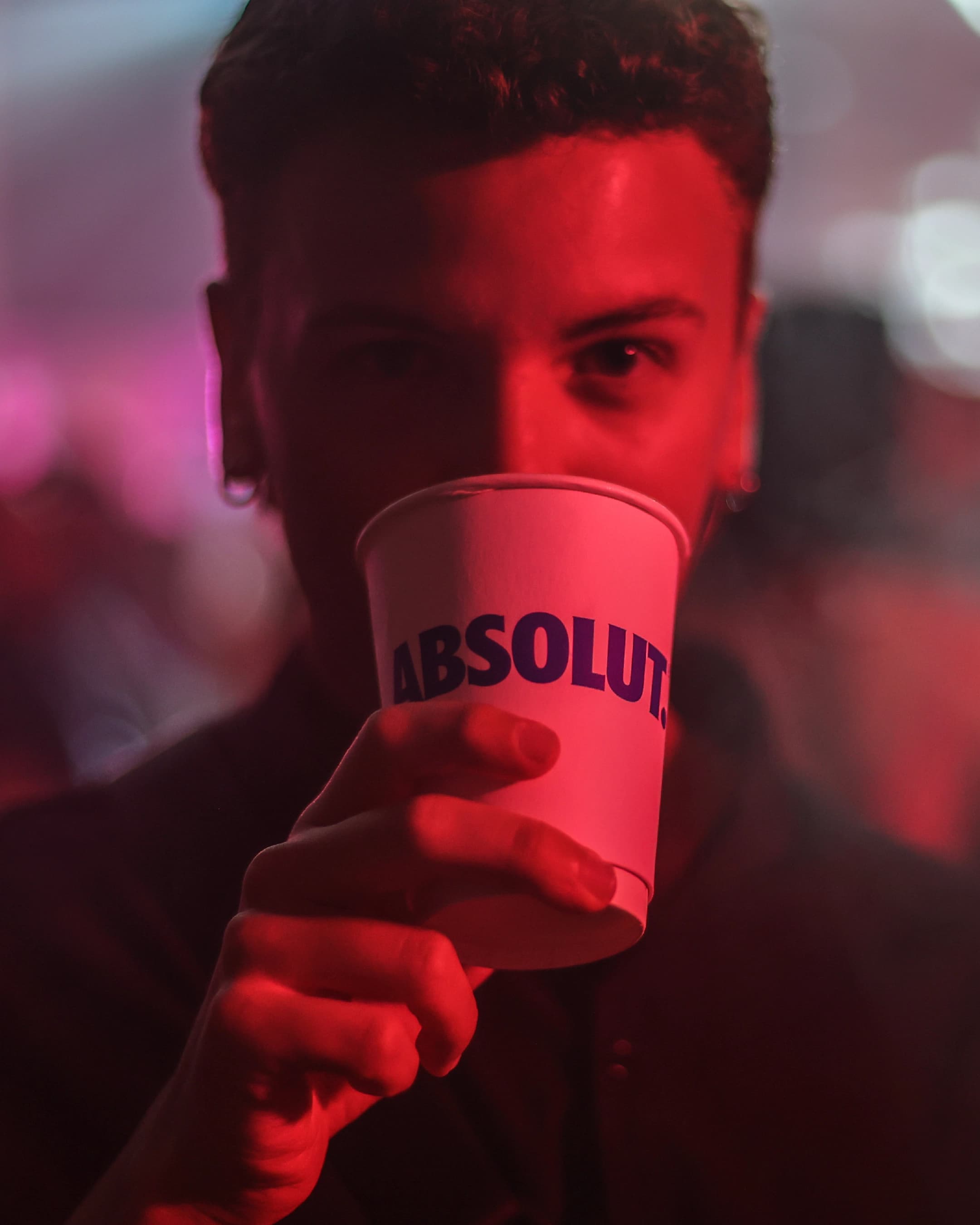 Guest holding a branded Absolut cup during Love Night