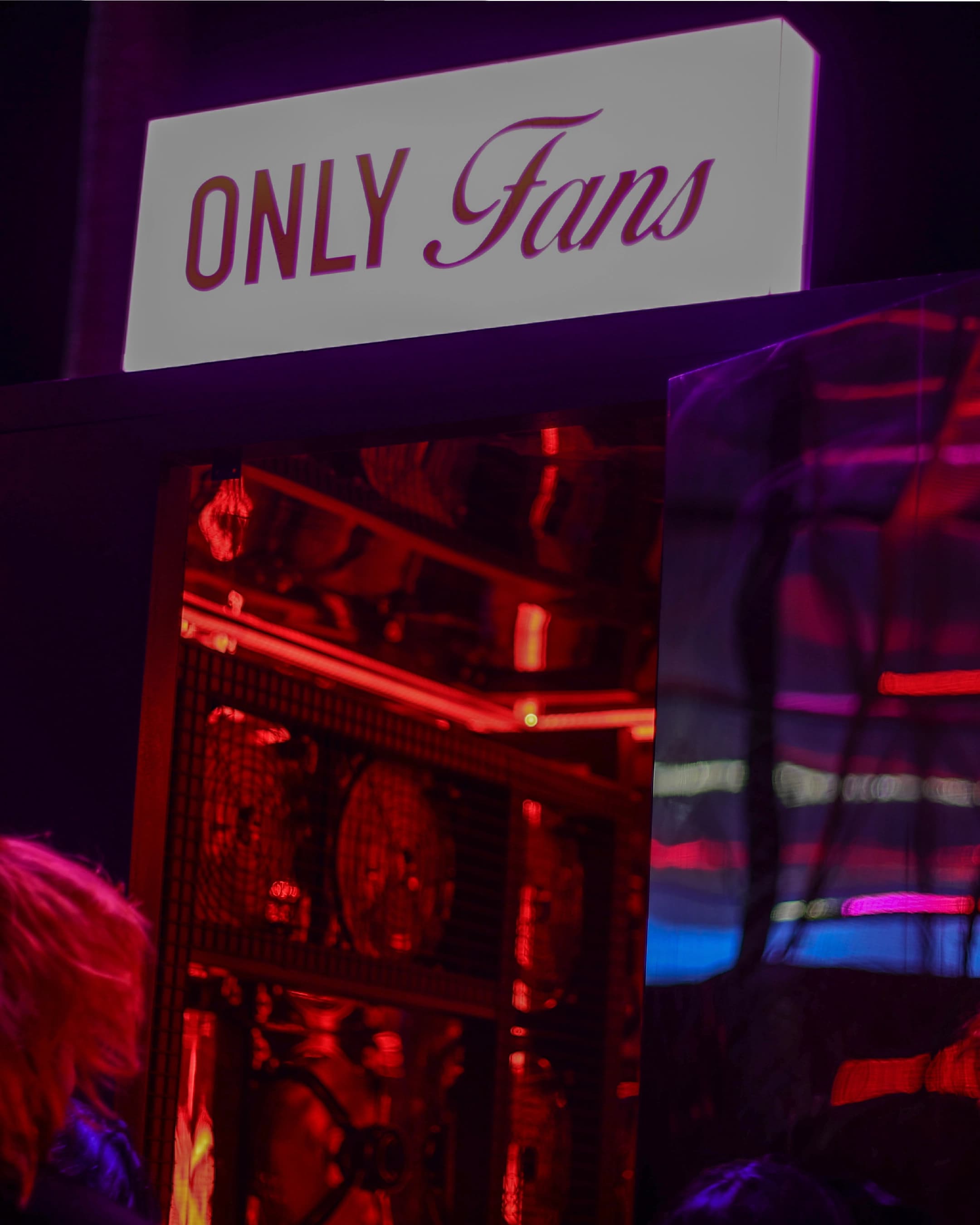 Only Fans neon sign installed above a bank of fans at Absolut Love Night