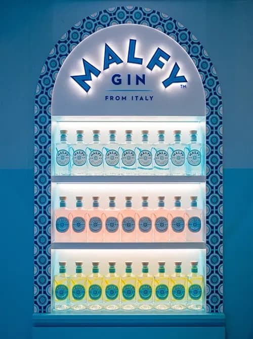 Backlit Malfy Gin cooler with an arched header and tiled border