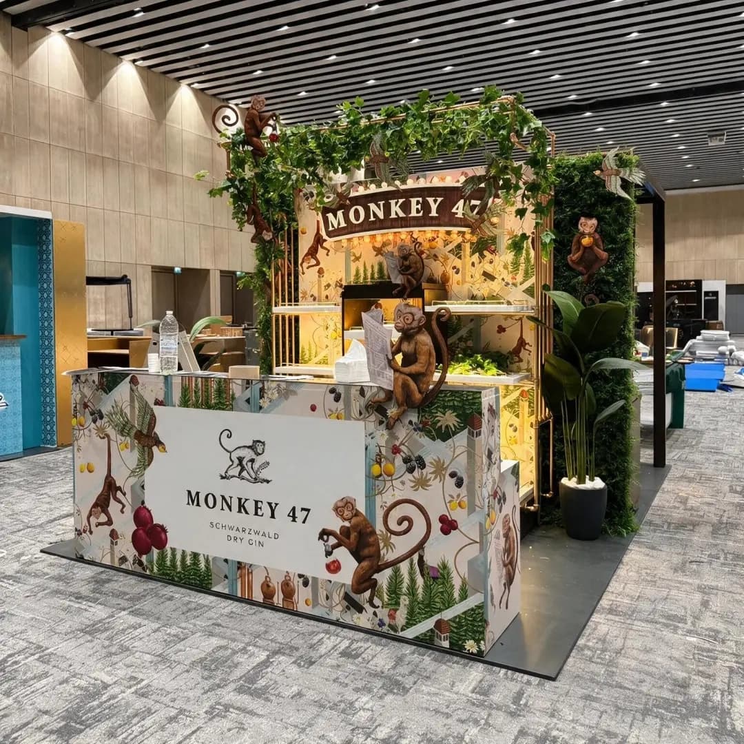 Illuminated Monkey 47 bar front with tiered bottle shelving and a botanical canopy